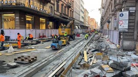 Workers at work on one of the construction sites of the Bologna tram network.