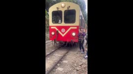 Tourist taking selfie in front of oncoming train is struck by vehicle