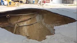 Huge sinkhole opens up in road in India
