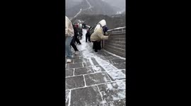 Slippery climb on the Great Wall amid heavy snow in China