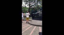Foreign tourists take photos of sleeping cat in Intramuros, Manila, Philippines
