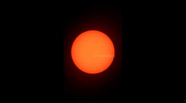The Sun with spots through a polarised lens filter