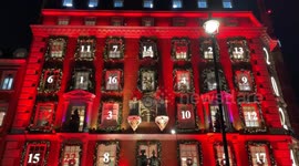 A giant Christmas red advent calendar adorns the facade of Fortnum & Mason on Piccadilly in London