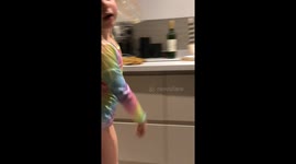 Rae dancing in kitchen