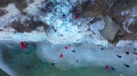 China: Tourists Enjoy The Ice Hanging on A Cliff in Zaozhuang