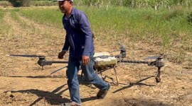 Thai farmers now using drone technology to help on the farm in rural Thailand.