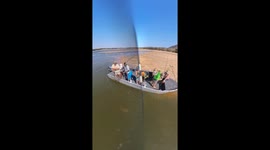 Crocodile approaches boat during fishing in Zambia