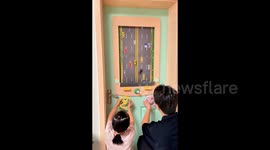 Handy dad builds world of DIY toys for daughter including 2-player driving game on bedroom door