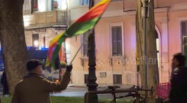 A man waves the Flag of the Movement for a Democratic Society (TEV-DEM) in Rojava during the demonstration called by the Kurdistan Italia Information Office with the slogan 'Defend Rojava' in Rome.