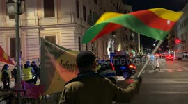 A man waves the Flag of the Movement for a Democratic Society (TEV-DEM) in Rojava during the demonstration called by the Kurdistan Italia Information Office with the slogan 'Defend Rojava' in Rome.