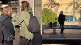 People waiting for a metropolitan train in one of the stations on the outskirts of Rome.