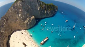 Basejumper makes leap over beautiful waters of Mediterranean island