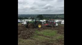 Tractor pulling a tractor pulling a campervan gets stuck at Glastonbury