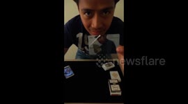 Magician pulls off cool trick with business card