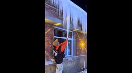 Man falls while attempting to break an icicle in Xinjiang, China