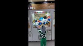 Kid scores double win on a claw machine in Suwon, South Korea