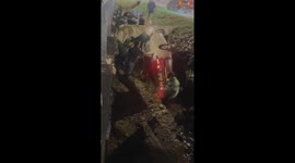 Passersby rescue trapped driver from overturned car