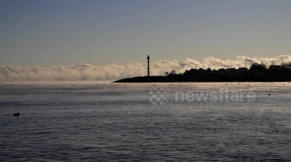Freezing temperatures in Massachusetts create sea smoke on Marblehead Harbor