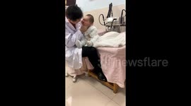 Doctor treats baby with titled head by gently kneading it like dough