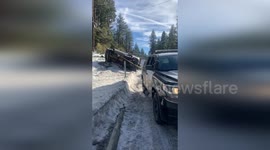 US: Police Rescue Overturned Vehicle Amid Icy Road Conditions in Truckee