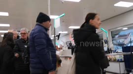 Shoppers queue up in long queues on Christmas Eve in East London