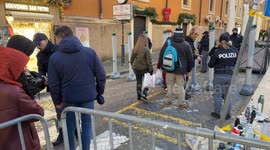 Police officers on Via della Conciliazione check pilgrims heading to St. Peter's Square on Christmas Eve in Rome.
