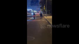 China: Joyful Leg Swing on a Scooter