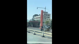 Chinese man transports hundreds of pig balloons on motorcycle
