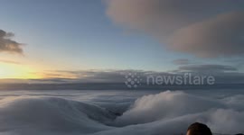 China: Sunrise Above the Clouds