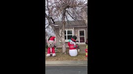 Grumpy inflatable snowman amuses neighbours