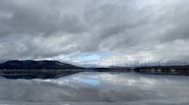 Amazing moment after lake freezes and heavy rain, it looks like an open body of water