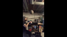 Playing Mozart on keyboard while spinning a basketball on a mouthstick