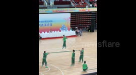 China: The Guangdong team performed stunts such as bamboo pole stepping and backflips