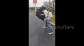 China: A Girl Tries to Fight with Typhoon