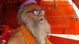 India: A Sadhu living in Rikshaw at Kumbh
