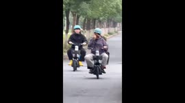 Friends riding electric scooters collide and crash in China