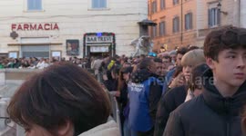 Tourists on New Year's Day visit the Trevi Fountain with regulated access after it reopened following cleaning work for the Jubilee in Rome.