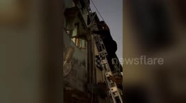 7-year-old hangs onto second-floor railing after grill collapses, rescued unharmed