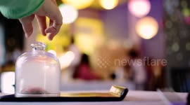 Smoke dome opening with delicious meat inside in high cuisine restaurant in Spain.