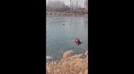 Man trapped in icy river saved by firefighters