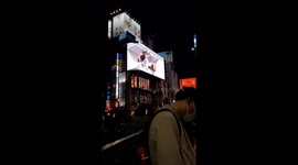 Giant 3D billboard near Central Station in Shinjuku by night.