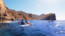 Kayakers in Cala cerrada beach at the south of Spain rowing in grup during August 2024