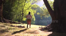 Hiker woman walks at grassland in Ordesa Park at the north of Spain