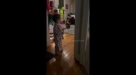 Two young boys can't believe their eyes as Santa spotted in their front room