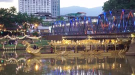 Golden Heavenly Boat launches on the Ping River in Chiang Mai, Thailand
