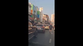 Tourist angry at ignorant drivers clears cars blocking the path of ambulance in Bangkok