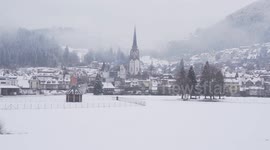 Beautiful small town in the Blackforest in winter fog at day time.