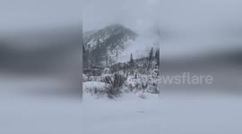 Avalanche mitigation causes snow to plunge down mountainside