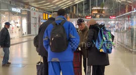 Volunteers distribute food to regulars at Termini Station in Rome.