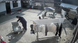 Sunbed slowly topples over as resident watches phone